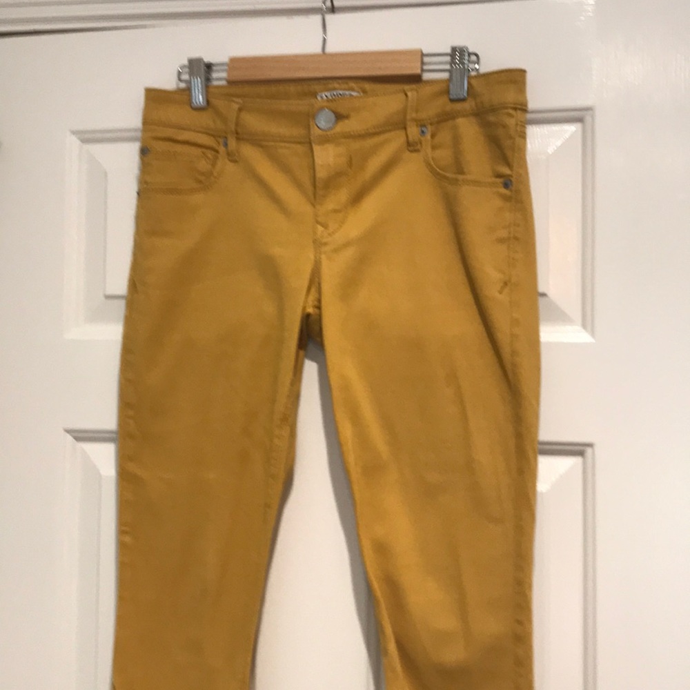 Pair of Express jeans.  Size 4. Mustard color.